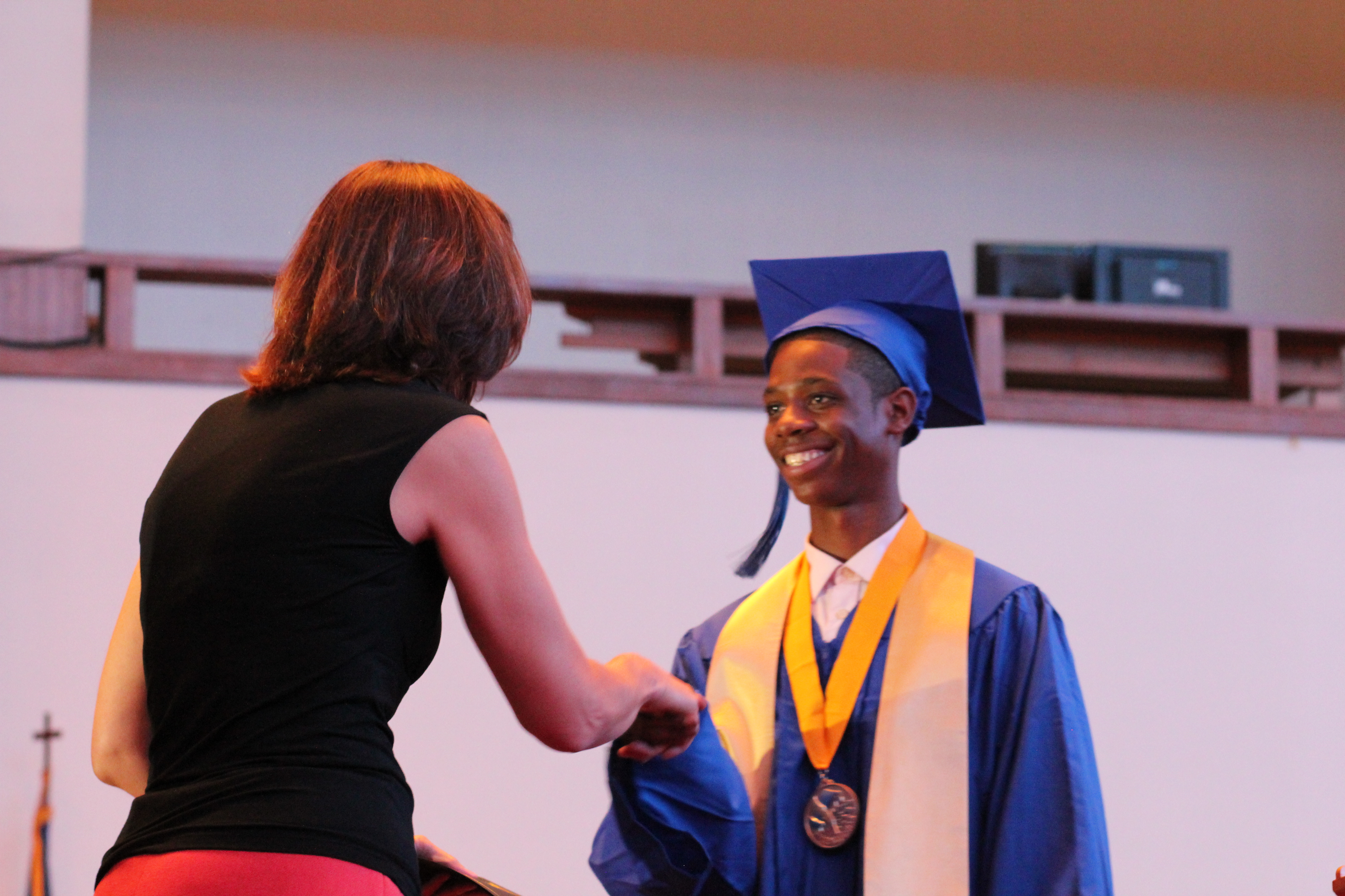 Class Valedictorian Derrick Davenport receives his diploma