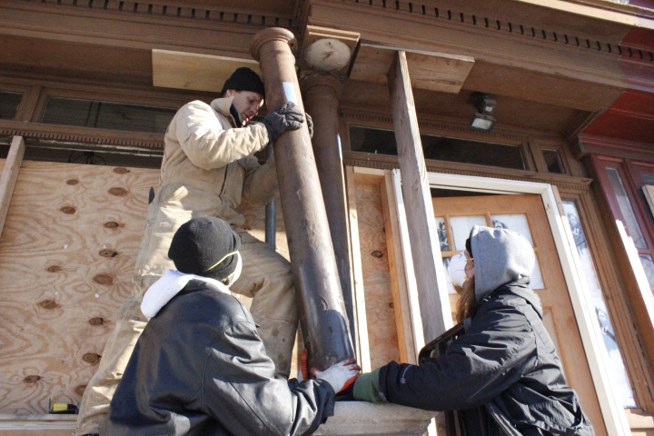 YouthBuild students preserved history by restoring the porch of the John Coltrane House.